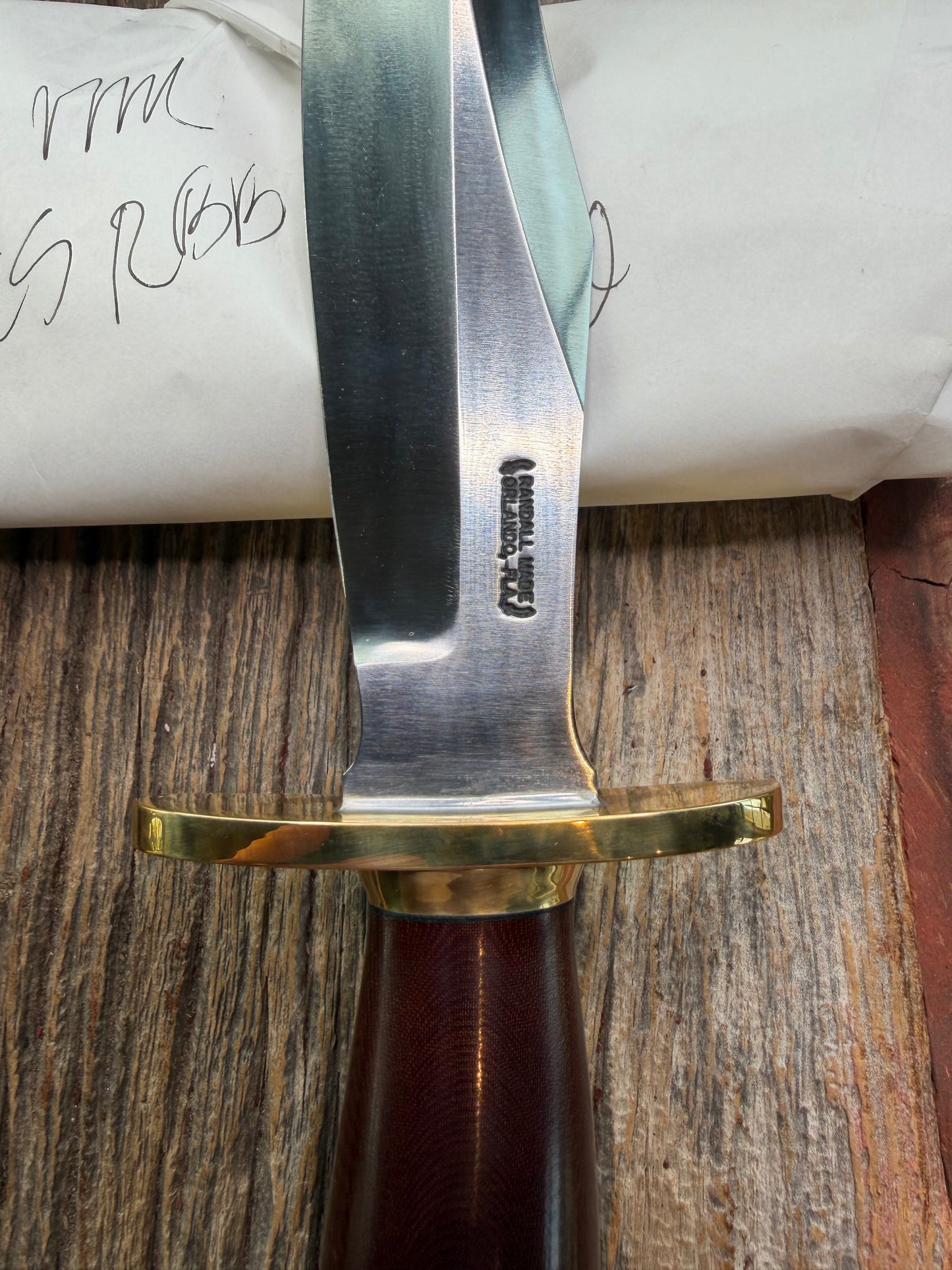New in Paper Randall Model 12-8 Big Bear with a Maroon Micarta handle. Brass Hilt  and Brass collar, Carbon steel, brass butt cap.