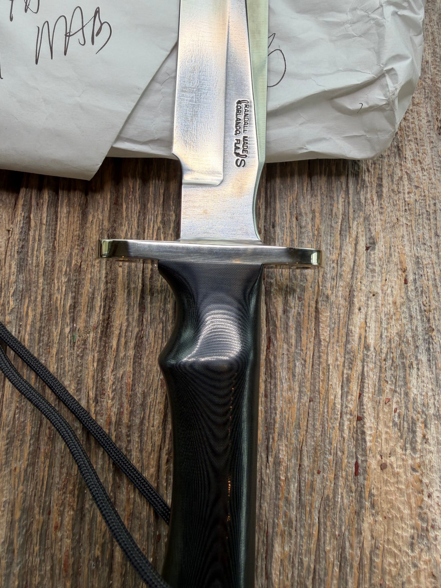 New in Paper Randall Model 16 SP#1 Special fighter with a Black Micarta handle. SS blade, Nickel silver Double hilt. Lanyard. Brown leather sheath.