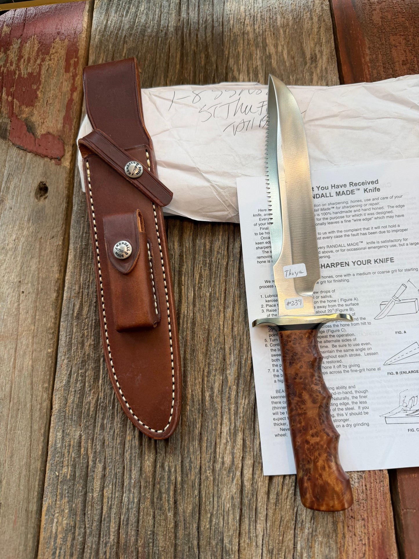 New in Paper Randall Made Knife Model 1-8 in Thuya wood. Stainless, single Black spacer, Sawteeth, Nickel Hilt.