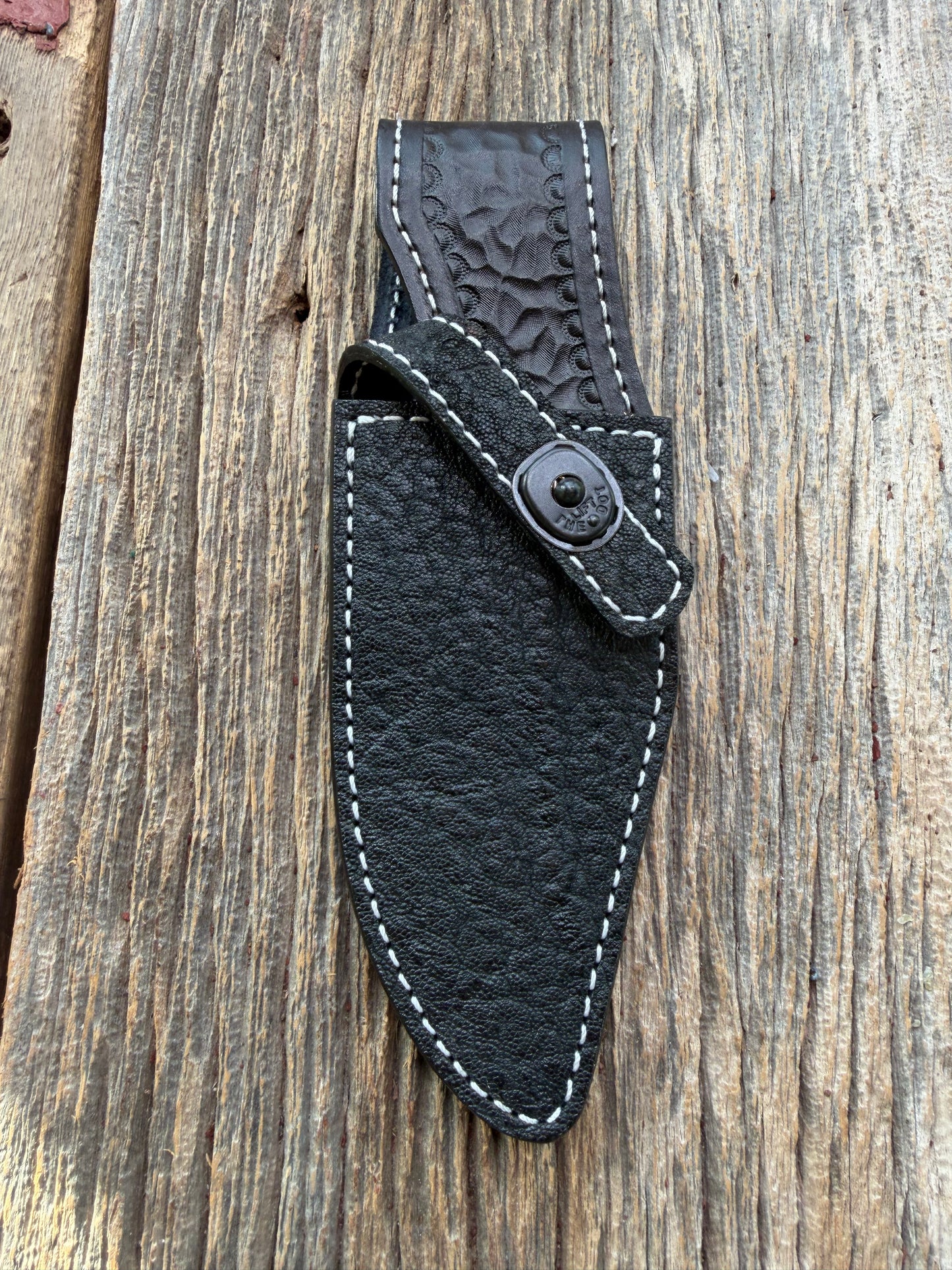New Randall Model 19-5 Sheath in Exotic thick and textured Black Elephant hide on black leather from Treeman with a black Canteen snap. Hand tooled belt loop. Killer sheath.