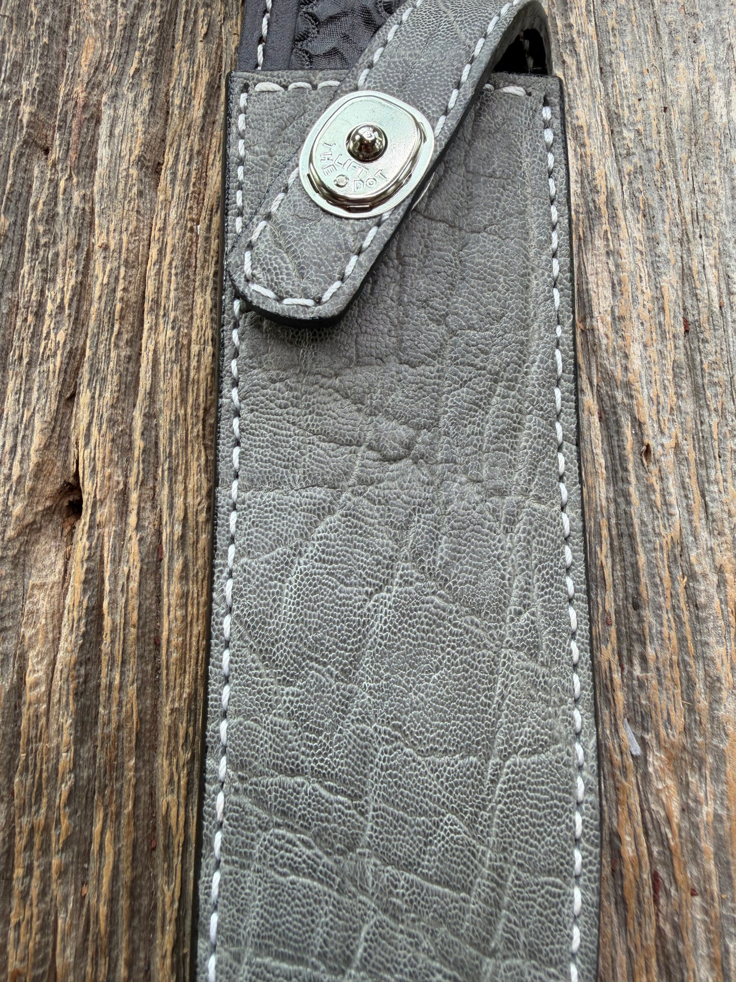 New Randall Model 1-8 Sheath in Exotic thick and textured Grey Elephant Hide on black leather from Treeman with a silver Canteen snap. Hand tooled belt loop. Killer sheath.