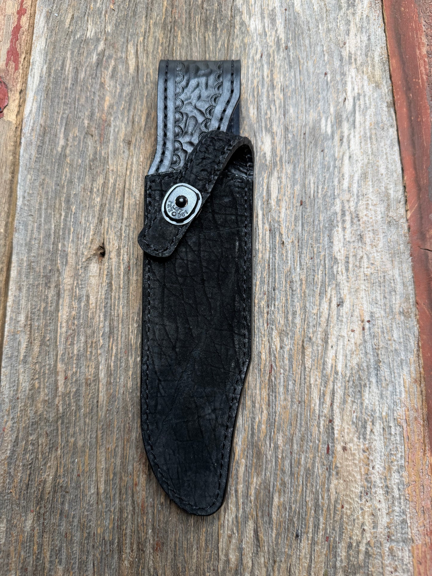 Randall Model Buxton Fighter in Black Hippo, forward curved hilt, black Canteen Snap, full brass stamping and stitching.