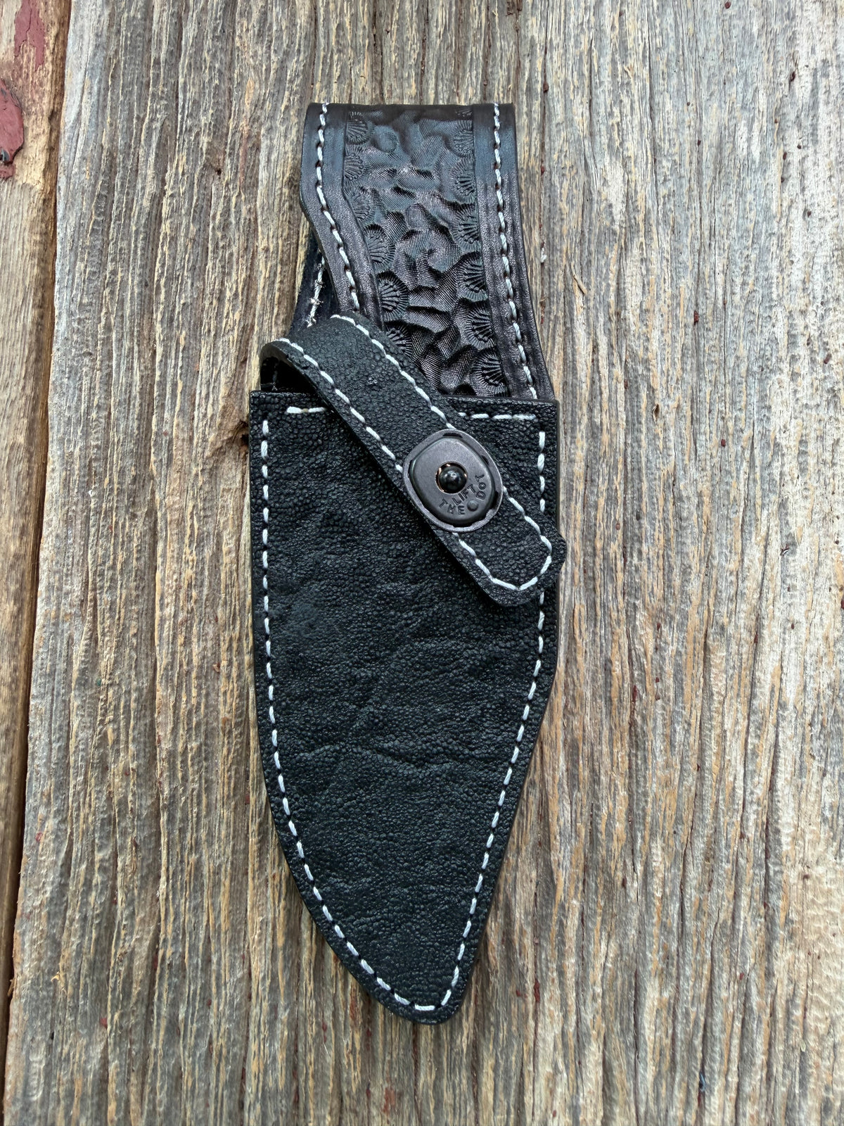 New Randall Model 19-5 Sheath in Exotic Black Matte Elephant Hide from Treeman with a Black Canteen snap. White thread deviated stitching on black leather..Killer sheath.