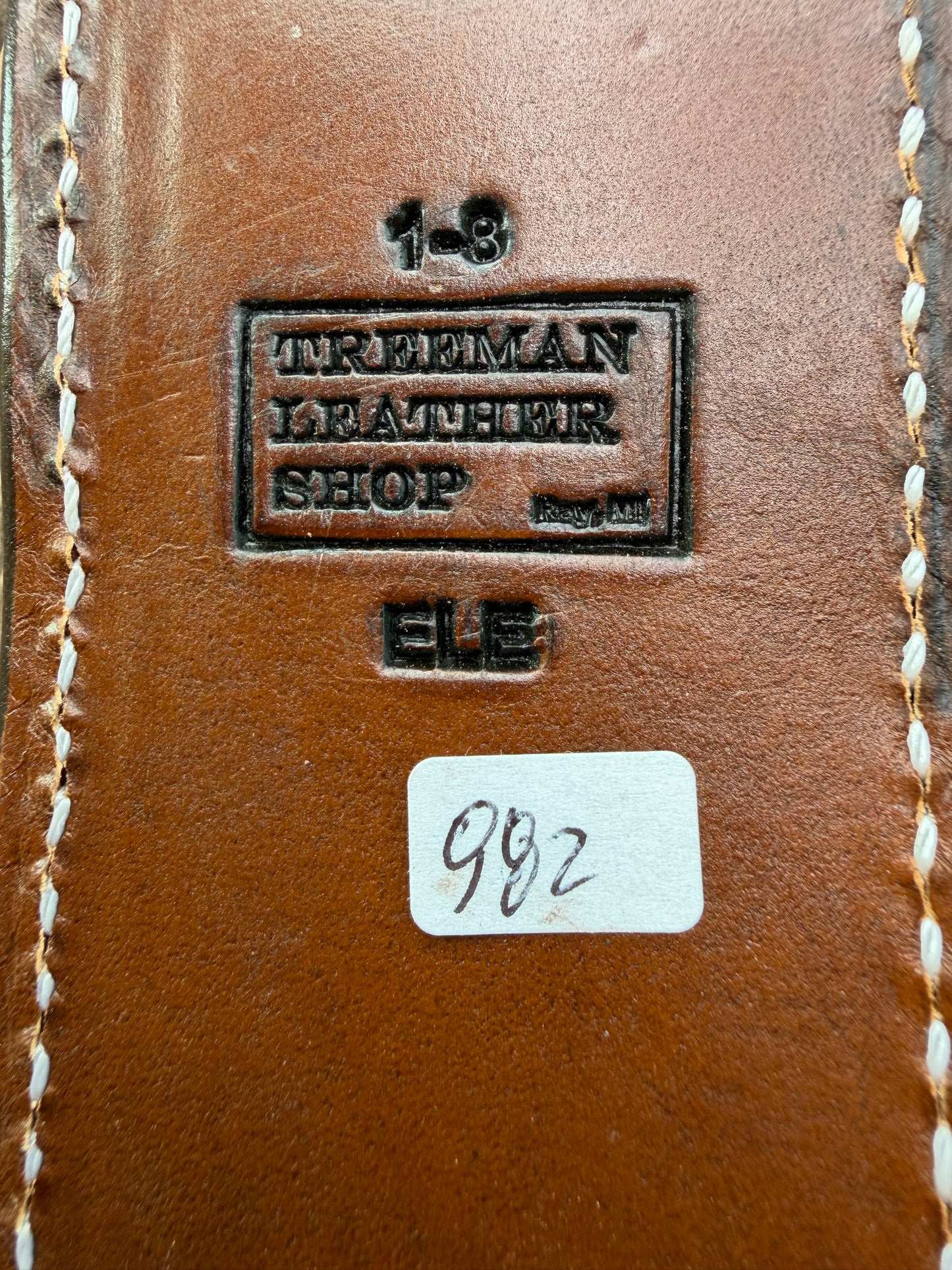 New Randall Model 1-8 Sheath in Exotic thick and textured Black and Grey Elephant Ear  on brown leather from Treeman with a silver Canteen snap. Hand tooled belt loop. Killer sheath.