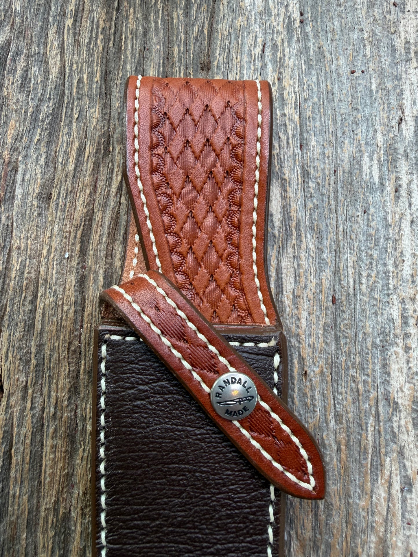 Pristine Randall Model 25-5 sheath in Exotic Cape Buffalo leather from Sullivans by Gutcher. Heavily tooled belt loop and strap. Randall snap and clean stamping on the back … perfect!!