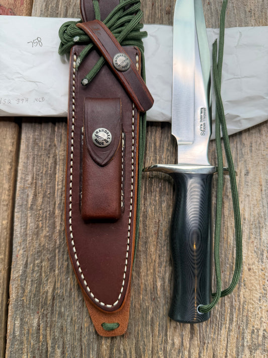 New in Paper Randall Model 16 SP#1 Special fighter with a Black Micarta handle. SS blade, Nickel silver hilt. Lanyard. Brown leather sheath.