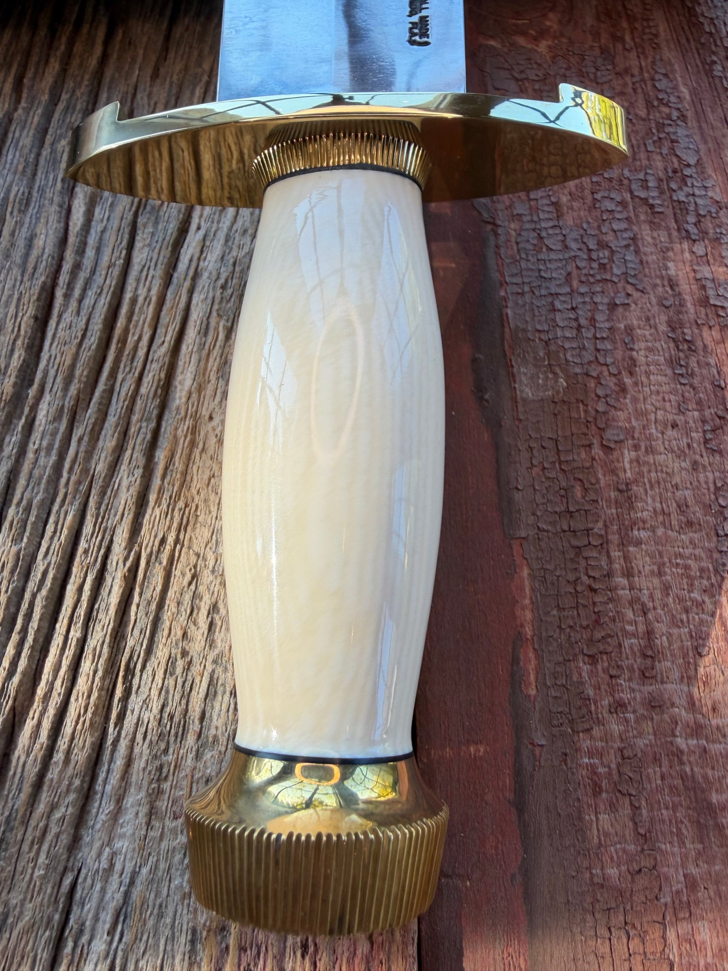 New in Paper Model 12-11 Smithsonian “ Smitty” Beautiful Dave Warthers Resin with a Brass Lugged hilt and Scalloped brass collar and scalloped coolie butt cap.