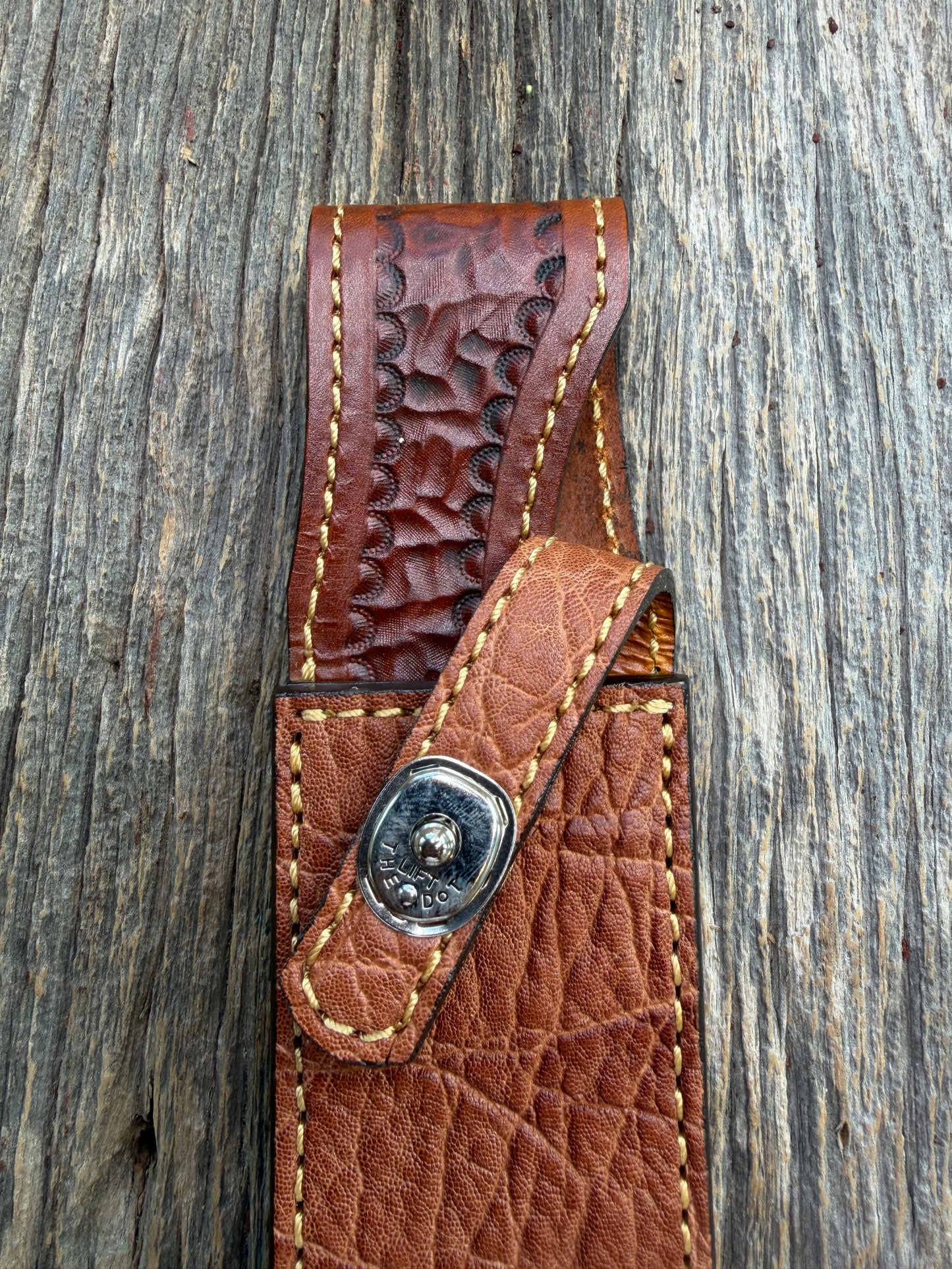 New Randall Model 1-8 Sheath in Exotic thick and textured Rust colored Elephant hide on brown leather from Treeman with a silver Canteen snap. Hand tooled belt loop. Killer sheath.