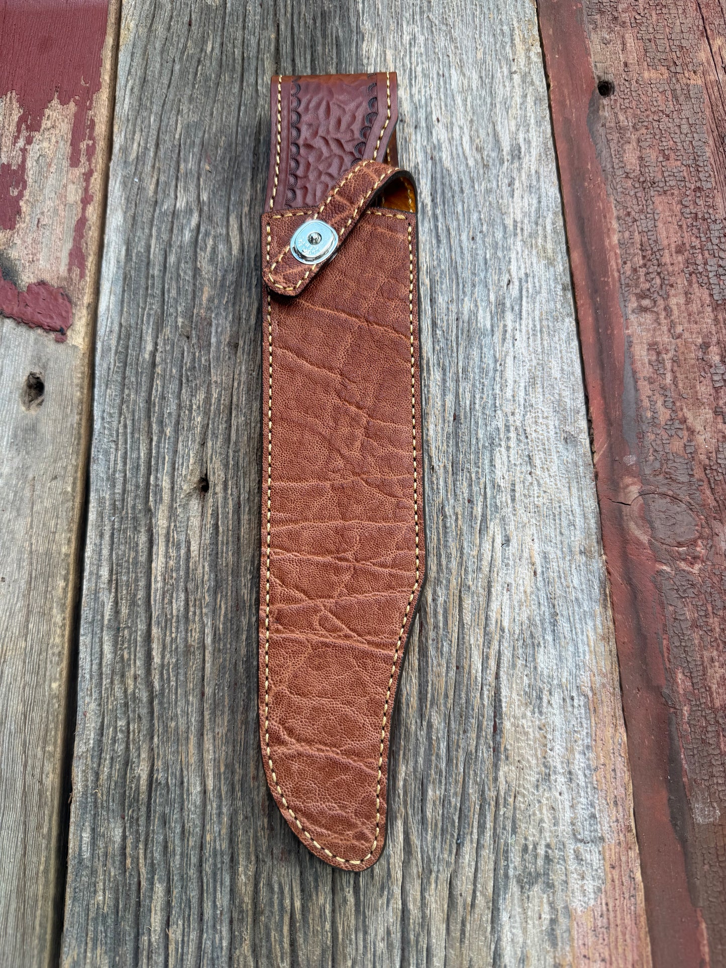 New Randall Model 12-11 Confederate Sheath in Exotic thick and textured Rust colored Elephant hide on brown leather from Treeman with a silver Canteen snap. Hand tooled belt loop. Killer sheath.