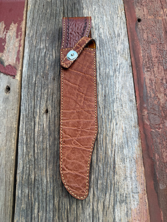 New Randall Model 12-11 Confederate Sheath in Exotic thick and textured Rust colored Elephant hide on brown leather from Treeman with a silver Canteen snap. Hand tooled belt loop. Killer sheath.