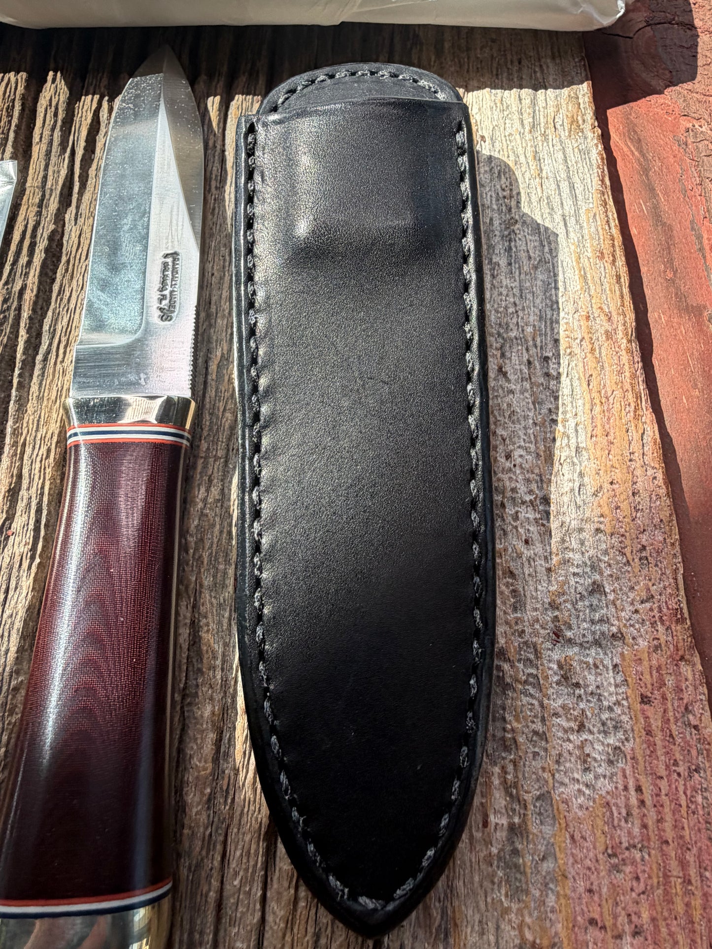 New in Paper Randall Model “Gambler” 4 Inch in a Maroon Micarta handle, Nickel hilt, Stainless steel blade, rounded nickel silver butt cap.