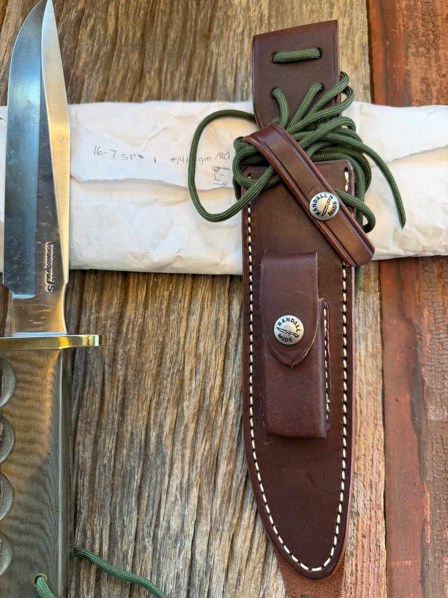 New in Paper Randall Model 16 SP#1 Special fighter with a Green Micarta handle. SS blade, Nickel silver hilt. Lanyard. Brown leather sheath.
