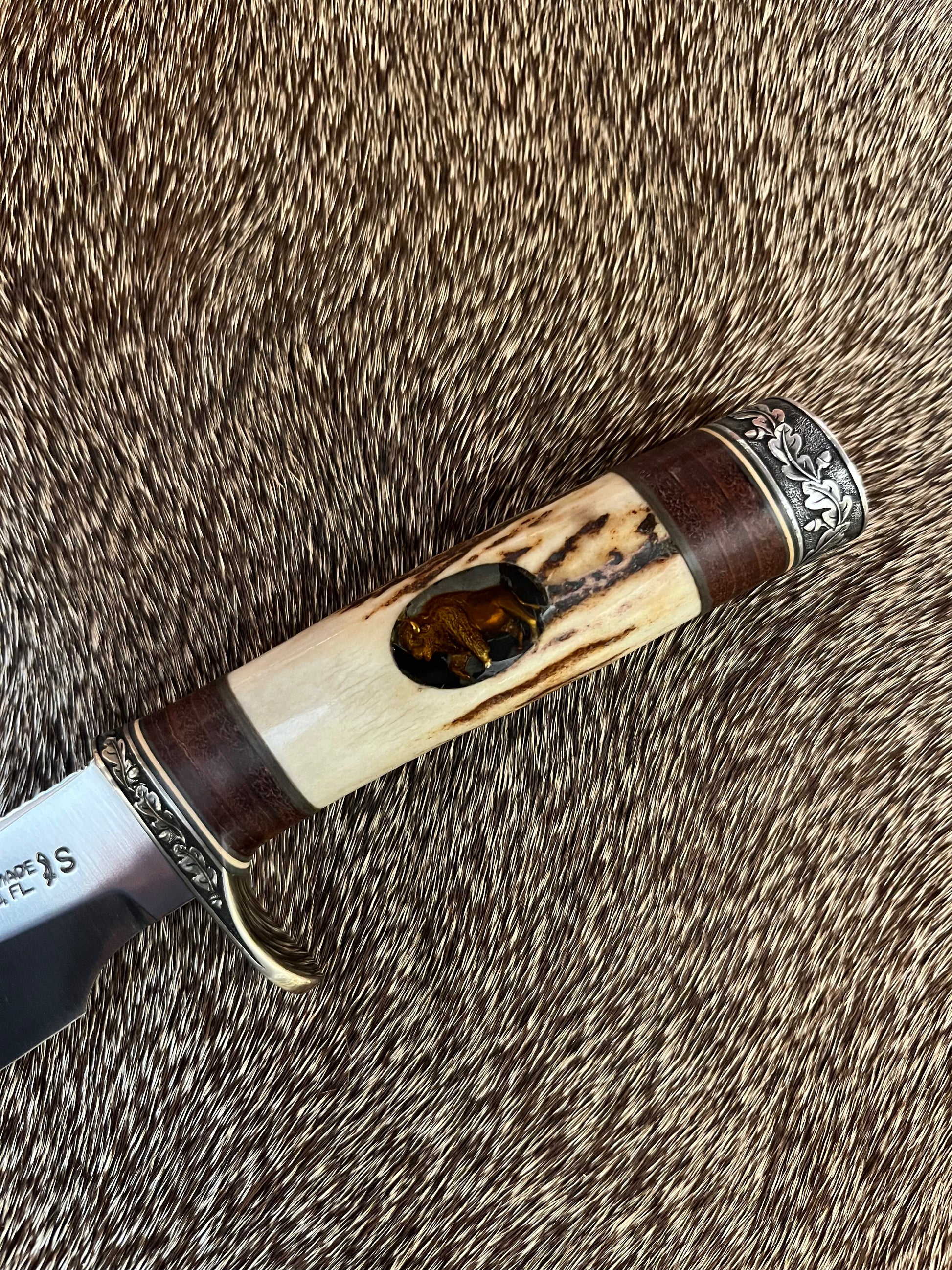 Model 25-Trapper 5” Tom Leschorn Carved, with Alaskan Gold Nugget Carved into a Buffalo