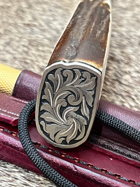 Stanaback Special Stag Slab Side, this is the large Stanaback with Stainless 3 5/8” Blade, Nickel Silver Butt Plate and Single Hilt with Aluminum & Black Spacers and Engraved by Master Engraver Jere Davidson with Fine Silver inlay
