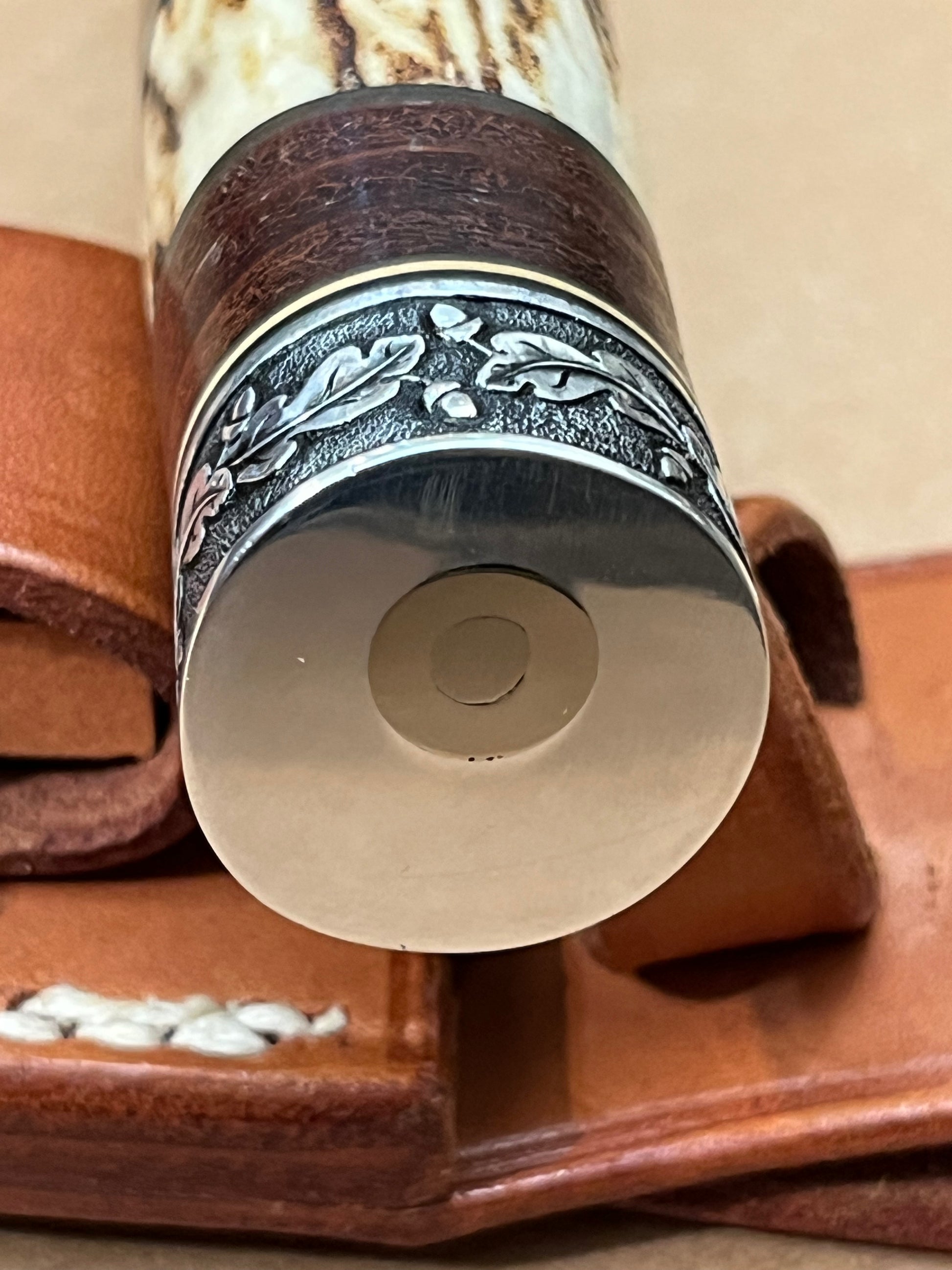 Model 25-Trapper 5” Tom Leschorn Carved, with Alaskan Gold Nugget Carved into a Buffalo